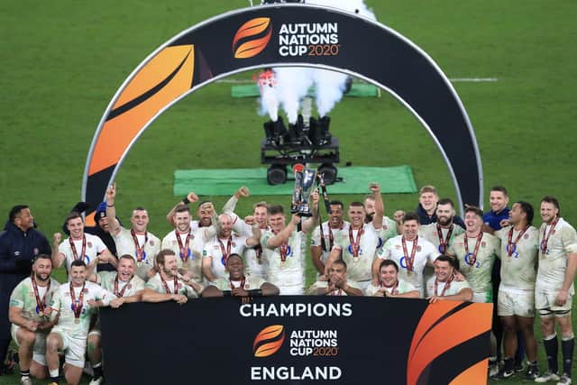 Sweet success: England's Owen Farrell, centre, lifts the Autumn Nations Trophy after victory in the Autumn Nations Cup. Picture: Adam Davy/PA Wire.