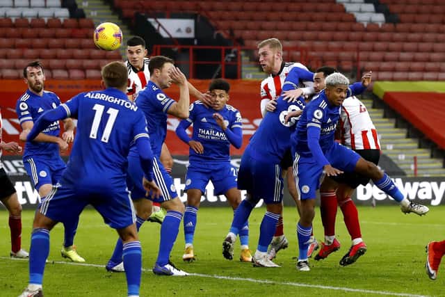 Sheffield United's Oli McBurnie (centre right) heads the ball to score.