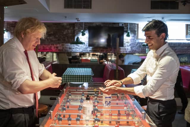 Boris Johnson and Rishi Sunak during a visit to a restaurant earlier this year.