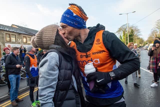 Kevin Sinfield with his wife after finishing his final 7 in 7 marathon challenge (Picture: Bruce Rollinson)
