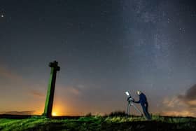 Richard Darn surveys the night sky as the moon sets at Ralphs Cross, Westerdale, on the North York Moors