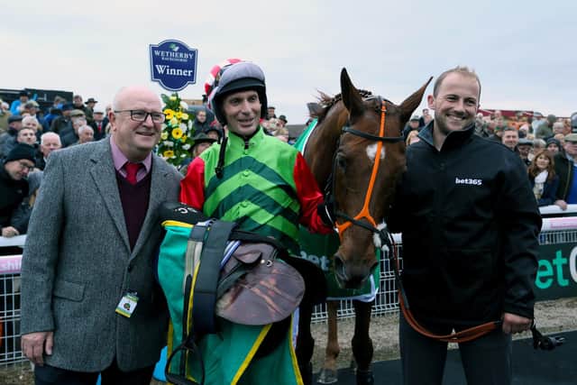 Owner Phil Martin (left) after Definitly Red won the 2018 Charlie Hall Chase at Wetherby.