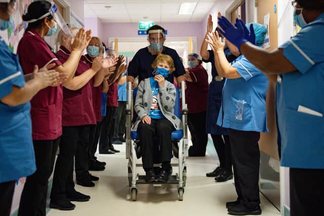 Margaret Keenan, 90, is applauded by staff as she returns to her ward after becoming the first person in the United Kingdom to receive the Pfizer/BioNtech covid-19 vaccine at University Hospital, Coventry, at the start of the largest ever immunisation programme in the UK's history.