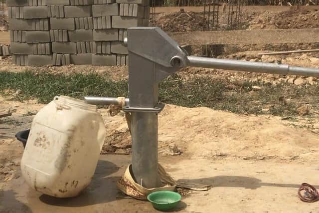 Claudia and Caitlin have funded a water pump in the village which means villageres no longer have to use water from a dirty stream