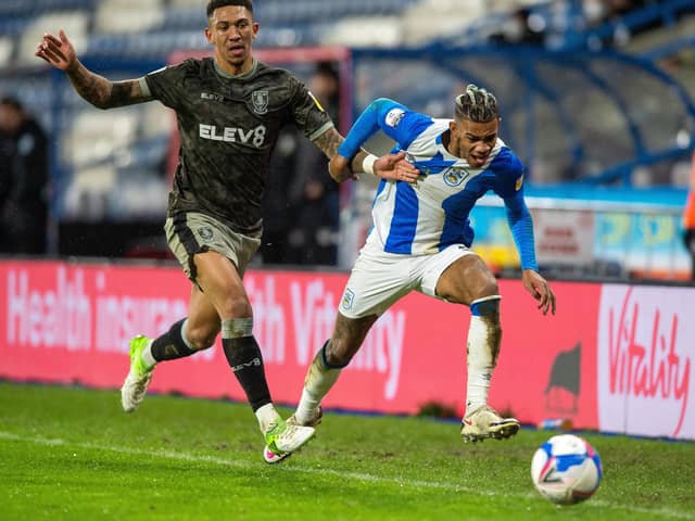 Liam Palmer and Juninho Bacuna chase down the line as Huddersfield Town defeated Sheffield Wednesday (Picture: Bruce Rollinson)
