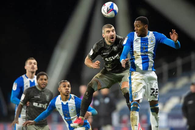 Callum Patterson and Jaden Brown challenge for a high ball as 
Huddersfield Town defeated Sheffield Wednesday. (Picture: Bruce Rollinson)