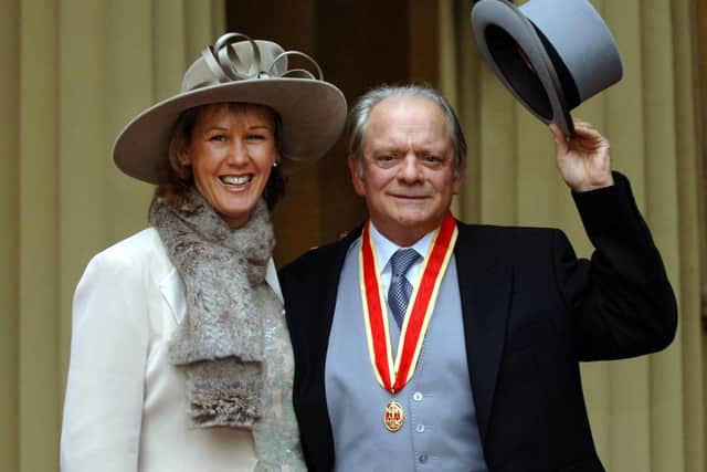 Sir David Jason and his wife Gill after collecting his knighthood at an investiture ceremony in 2005. Picture: Fiona Hanson/PA.