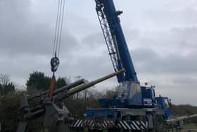The guns, which weight 10 tonnes, being craned away
