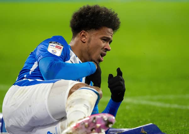 Josh Koroma signals to the best that's it and goes off injured during Huddersfield Town's midweek win over Sheffield Wednesday. (Picture: Bruce Rollinson)