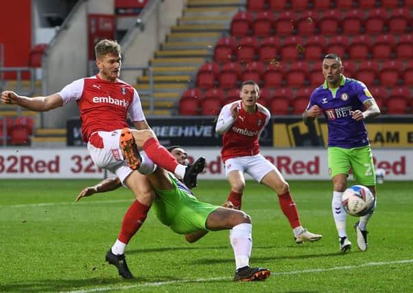 Get in: Rotherham's Michael Smith holds off  Bristol's Zak Vyner to score his side's second goal.
 
Pictures: Jonathan Gawthorpe