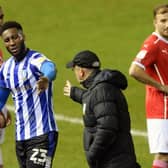 Well done: After a delayed Owls debut, Chey Dunkley gets a well done hand-shake from Tony Pulis after being substituted in the second half.  Picture: Steve Ellis