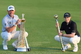 Sheffield's Matt Fitzpatrick poses with the DP World Tour Championship trophy alongside Lee Westwood, with the Race to Dubai Trophy at Jumeirah Golf Estates. (Photo by Ross Kinnaird/Getty Images)