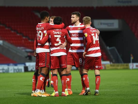 Reece James celebrates with his Doncaster Rovers teammates after opening the scoring against Gillingham. Picture: Howard Roe/HPIX LTD.