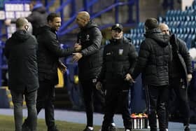HIGHS AND LOWS: Barnsley boss Valerien Ismael celebrates at Hillsborough as Sheffield Wednesday manager Tony Pulis contemplates another setback. Picture: Andrew Yates/Sportimage