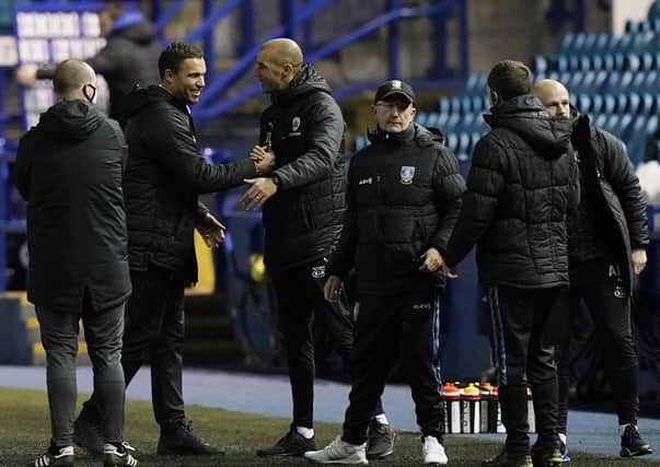 HIGHS AND LOWS: Barnsley boss Valerien Ismael celebrates at Hillsborough as Sheffield Wednesday manager Tony Pulis contemplates another setback. Picture: Andrew Yates/Sportimage