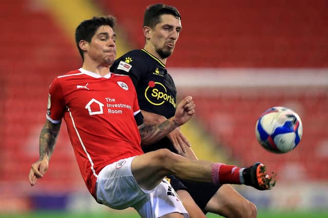 Barnsley's Dominik Frieser and Watford's Craig Cathcart (right) (Picture: PA)