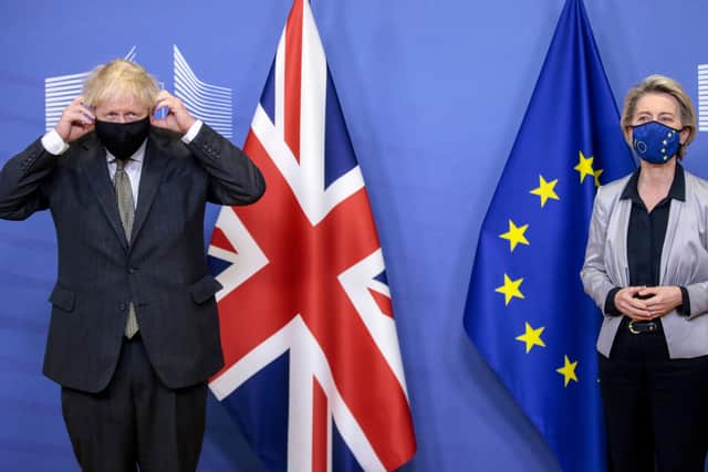 Britain's Prime Minister Boris Johnson  is welcomed by European Commission President Ursula von der Leyen in the Berlaymont building at the EU headquarters in Brussels.