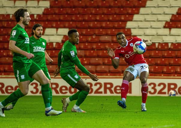 Victor Adeboyejo scores Barnsley's second goal past Declan Rudd. (Picture: Bruce Rollinson)