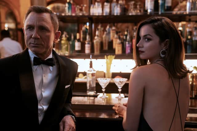 Daniel Craig playing James Bond and Ana de Armas playing Paloma in the new Bond film No Time To Die. Picture: Nicola Dove/Danjaq, LLC/MGM/PA Wire