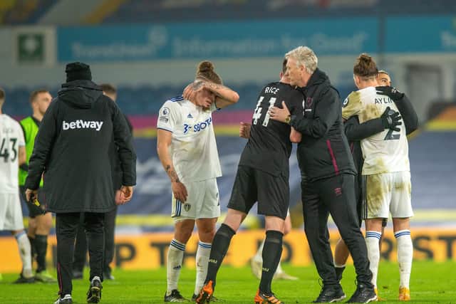 Kalvin Phillips shows his disappointment after defeat to West Ham at Elland Road, while Hammer's boss David Moyes celebrates with his team.
 Picture: Bruce Rollinson