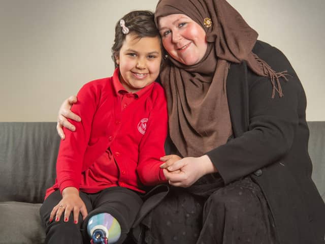 Anneeka Hussain of Leeds, who has received a Cancer Research UK for Children & Young People Star Award in partnership with TK Maxx. Anneka (8) has lost a leg after being diagnosed with cancer.Pictured with mum Kay.Photograph by Richard Walker/ImageNorth