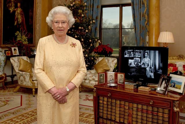 Queen Elizabeth II delivers her Christmas speech in the 1844 Room at Buckingham Palace, London in 2007, marking the 50th anniversary of her first televised Noel message. Picture: Steve Parsons/PA