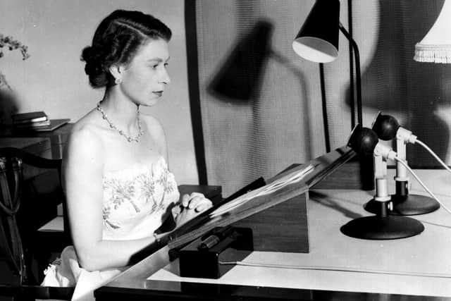 Queen Elizabeth II making her Christmas broadcast to the peoples of the British Commonwealth from Government House, Auckland, New Zealand in 1953. The speech was not televised until 1957.