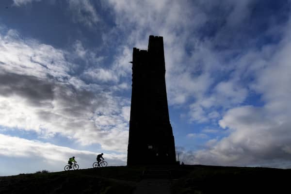 Cyclists are pictured riding up to Castle Hill, Huddersfield. Technical details: Nikon D5, 12-24mm lens, exposure 320th sec at f11, iso 200. Picture: Simon Hulme