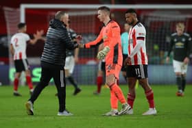 PRIDE: Chris Wilder shakes hands with his former on-loan goalkeeper Dean Henderson at full-time