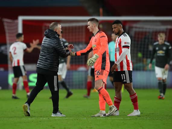 PRIDE: Chris Wilder shakes hands with his former on-loan goalkeeper Dean Henderson at full-time