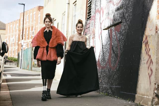 Picture by Rob Smalley of 
Sarah Dransfield, left. in pink coat by House of Sheldon Hall, and Bailie McGloin, who has vitiligo and wears a black shoulderless dress by Art School.