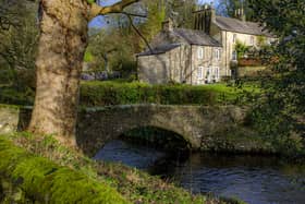 The packhorse bridge crossing Clapham Beck in the centre of the popular tourist location in the Yorkshire Dales near Settle. Picture: Tony Johnson