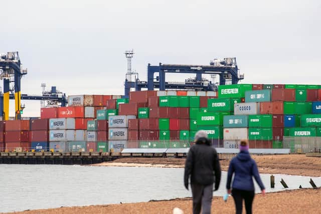 Shipping containers are unloaded from a cargo ship at the Port of Felixstowe in Suffolk. Picture: Joe Giddens/PA Wire.