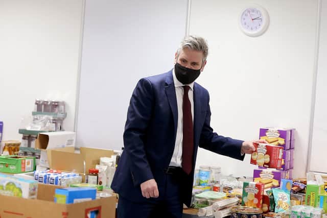 Labour leader Keir Starmer visits a food bank in Wakefield. Pic: PA
