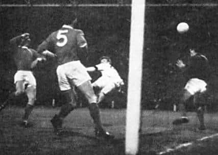 Hero: Billy Bremner scores for Leeds against Manchester United to take them through to Wembley.