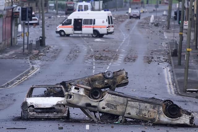 Burned out cars in the Manningham area of Bradford, after a night of violence in 2001.