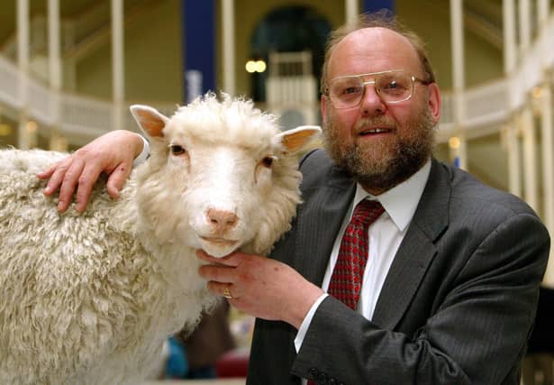 Professor Ian Wilmut of the Roslin Institute at Edinburgh University with Dolly, the world s first cloned sheep.