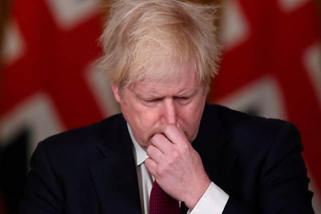 A crestfallen boris Johnson as he effectively cancelled Christmas for millions of families.