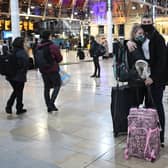 People wait on the concourse at Paddington Station in London, on the last Saturday shopping day before Christmas, after the announcement that London will move into Tier 4 Covid restrictions from midnight. Picture: Stefan Rousseau/PA Wire