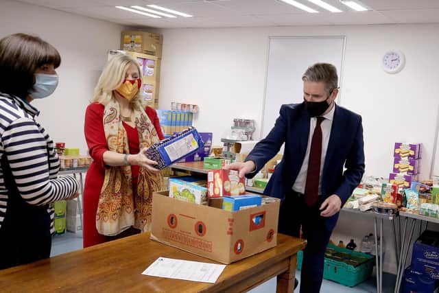Labour Party Leader Sir Keir Starmer, with Batley & Spen MP Tracy Brabin, Labour's candidate to be West Yorkshire mayor, packs food parcels with volunteers for residents during a visit to Lightwaves Leisure Centre in Wakefield.