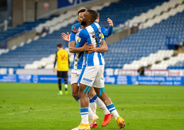 Great start: Fraizer Campbell celebrates his opening goal with Issac Mbenza. Picture: Bruce Rollinson