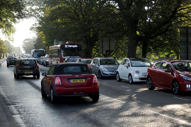 What should be done to reduce pollution in towns like Harrogate?