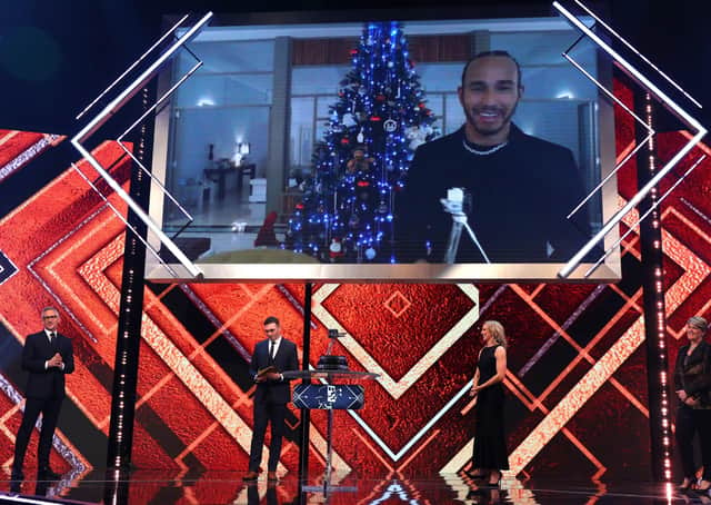 Lewis Hamilton reacts after winning the BBC Sports Personality of the Year Award during the BBC Sports Personality of the Year show. Picture: Peter Bryne/PA Wire.
