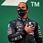 Winner: Lewis Hamilton celebrates on the podium after winning the Turkish Grand Prix to secure his seventh world championship. Picture: PA