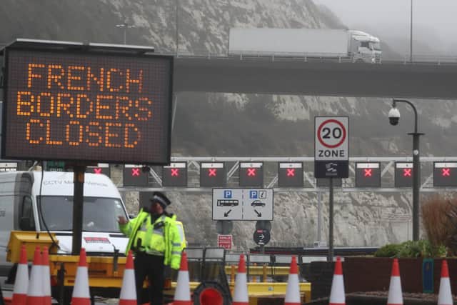 Police and port staff at the Port of Dover in Kent which has been closed after the French government's announcement it will not accept any passengers arriving from the UK for the next 48 hours amid fears over the new mutant coronavirus strain.