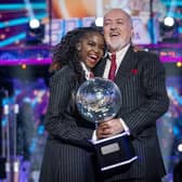 Bill Bailey and his dance partner Oti Mabuse and Bill Bailey winning the final of Strictly Come Dancing 2020.