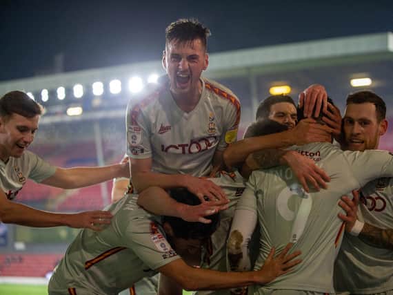 STUNNER: Bradford City's players celebrate Lee Novak's opening goal