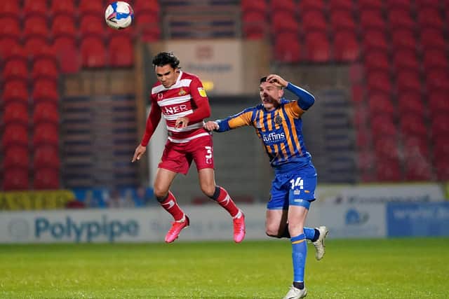 Doncaster Rovers' Reece James (left) and Shrewsbury Town's Matthew Millar in action at the Keepmoat.