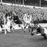 Double delight: Wakefield Trinity centre Ian Brooke scores one of his two tries in the 1967 Rugby League Championship final replay victory over St Helens at Station Road, Swinton.