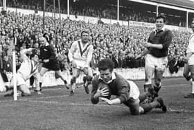 Double delight: Wakefield Trinity centre Ian Brooke scores one of his two tries in the 1967 Rugby League Championship final replay victory over St Helens at Station Road, Swinton.